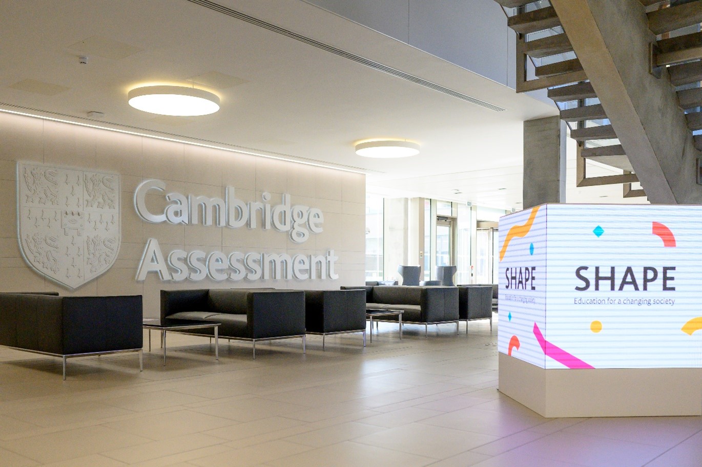 The reception area a the Triangle in Cambridge with a light box in the for ground saying Shape Education