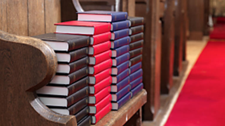 prayer books in a church pew