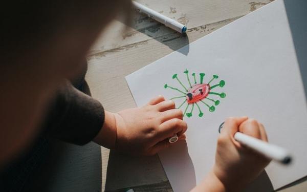 Child drawing covid virus