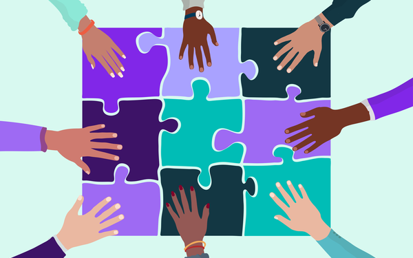 hands holding pieces of a jigsaw to demonstrate building a sense of belonging