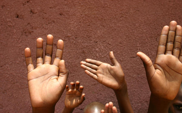 Children raising their hands
