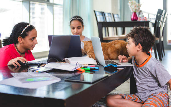 Children learning with laptops in the UAE