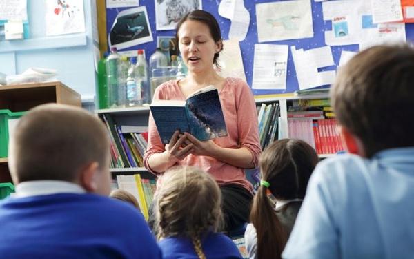 Teacher reading to students in classroom