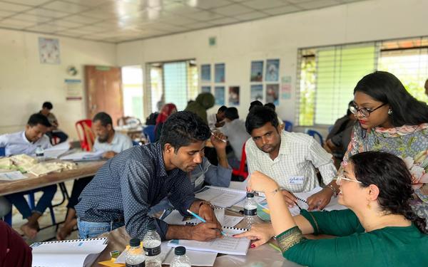 Teachers and trainers completing a training activity inside the Rohingya camp in Bangladesh