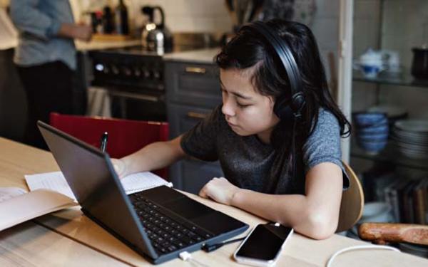 Young child working on laptop