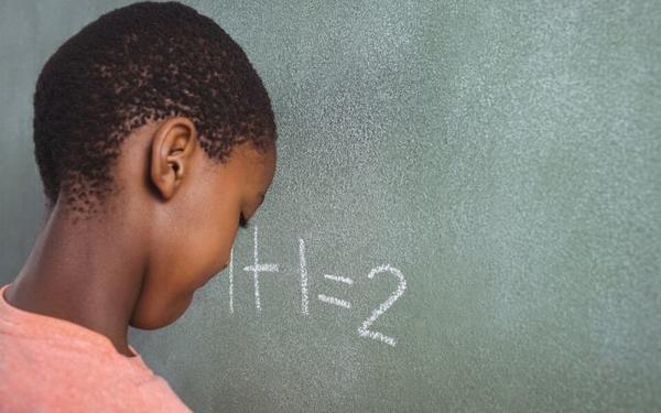 Boy at chalkboard