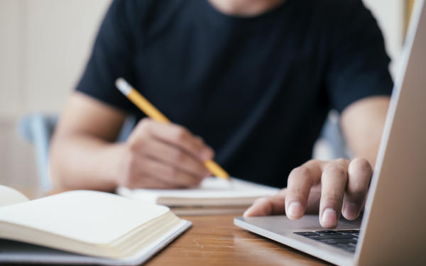 Man typing on laptop