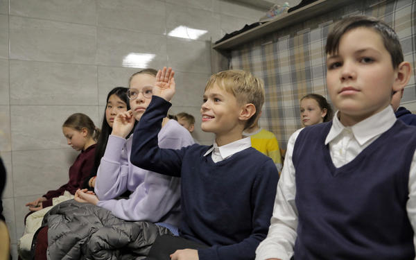 Children study in bomb shelter