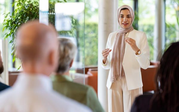 Woman presents to audience