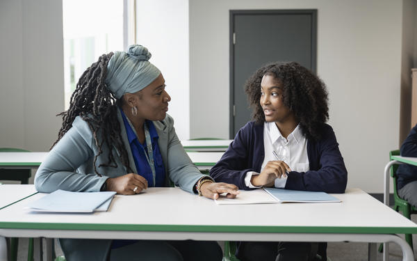 Teacher talking to student