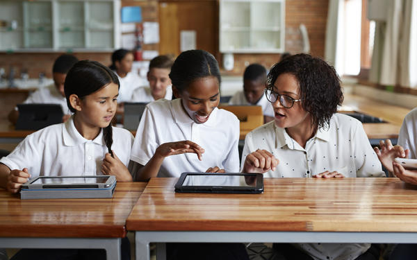 Students on ipads with teacher