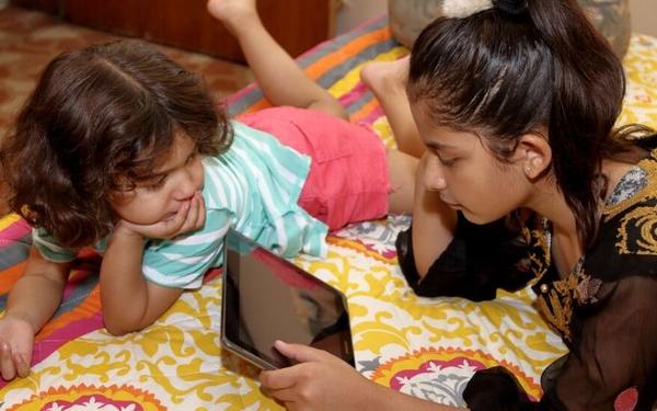 Children looking at tablet