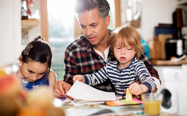 Dad with two young children
