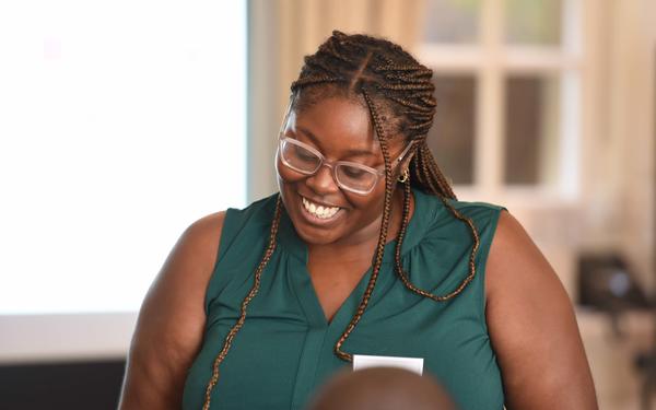 Tutor from Open Development Education smiles during class