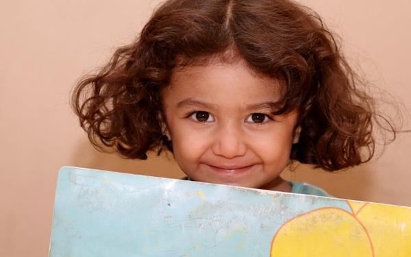 Girl holding poster