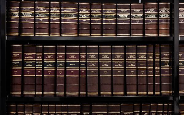 A wall of the archive exam paper designed by Cambridge