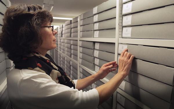 In the strongroom: Press Archivist, Dr Rosalind Grooms, looks for documents in the secure and carefully controlled environment of the University Library’s strongroom.