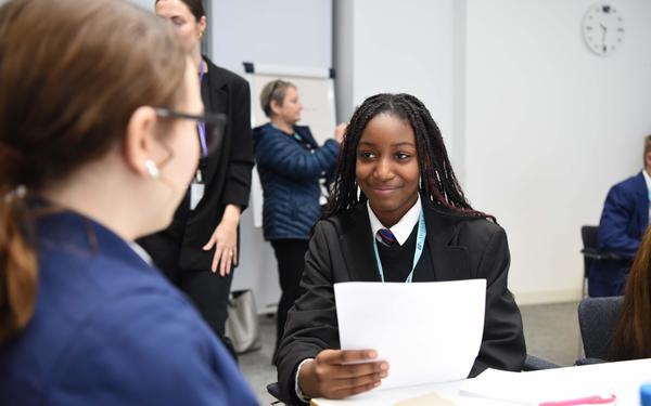 Student smiles while participating in mock interview event at Cambridge