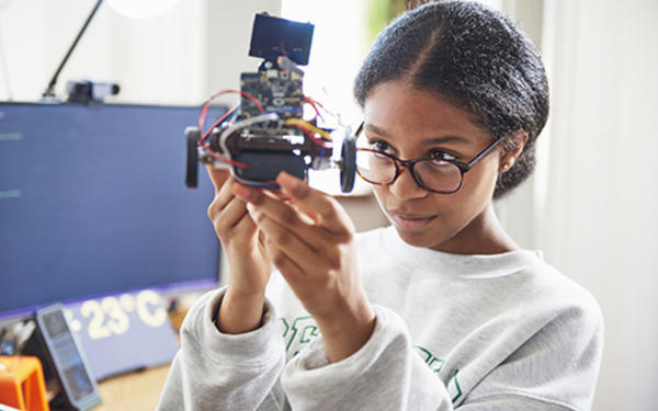 girl looking at robot