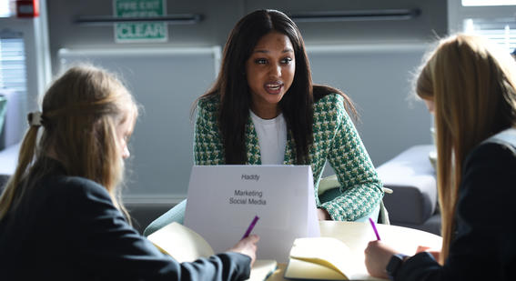 Haddy Ndure speaking to students at a careers event 