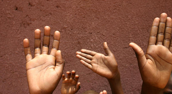 Children raising their hands