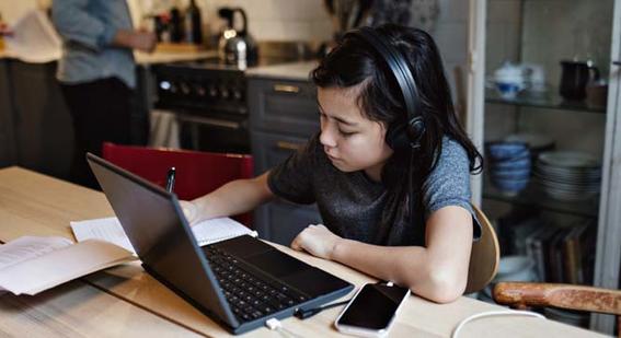 Young child working on laptop