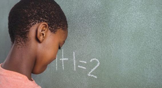 Boy at chalkboard