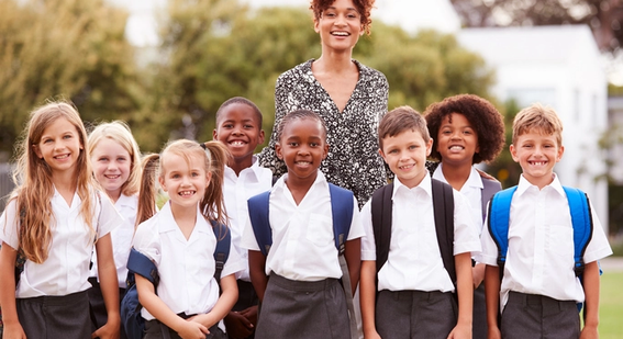 Teacher with students outdoors