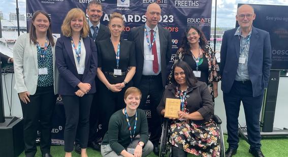 Cambridge colleagues pose with award