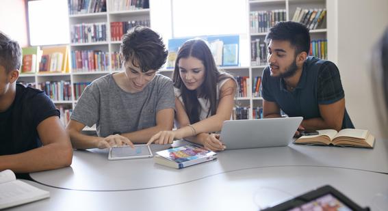 Group of three students online learning with a laptop and ipad