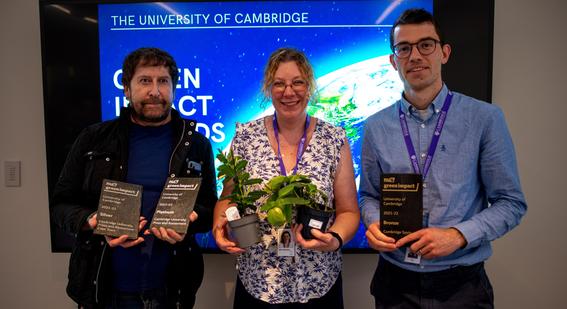 Cambridge colleagues holding Green Impact awards and prizes