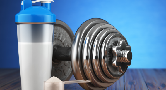 Image of supplement next to a dumbbell