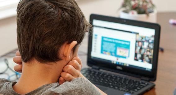 Boy watching laptop
