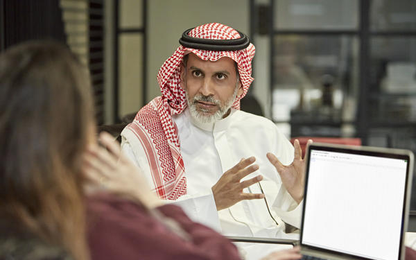 Business man talking to a colleague